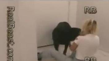 Pretty blonde woman makes love to huge rottweiler
