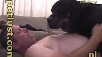 Amateur man plays with his dog's cock in a furry XXX home play