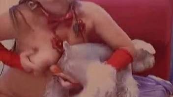 Webcam babe in crimson outfit blowing a pooch's hefty dick