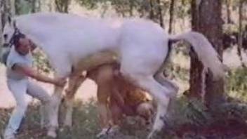 Curly-haired babe gets spit-roasted by a horse and a dude