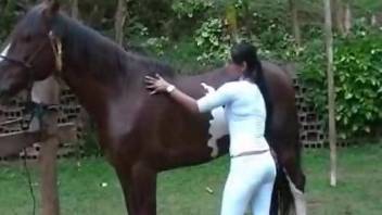 Hot woman getting undressed and jerking stallion's rod