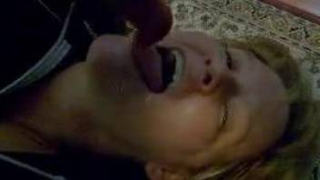 Short-haired mature getting dog's cum on her face