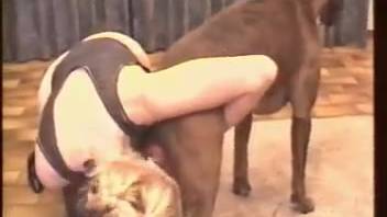 Attractive blonde hones her oral skills using her own dog's assistance