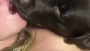 Masked zoophile enjoying hot sex with a black dog