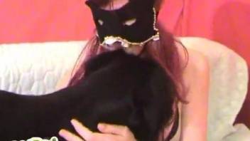 Redhead with mask corrupts dutiful doggie and jerks it off